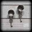 Antique silver key tunnel earrings on Sale